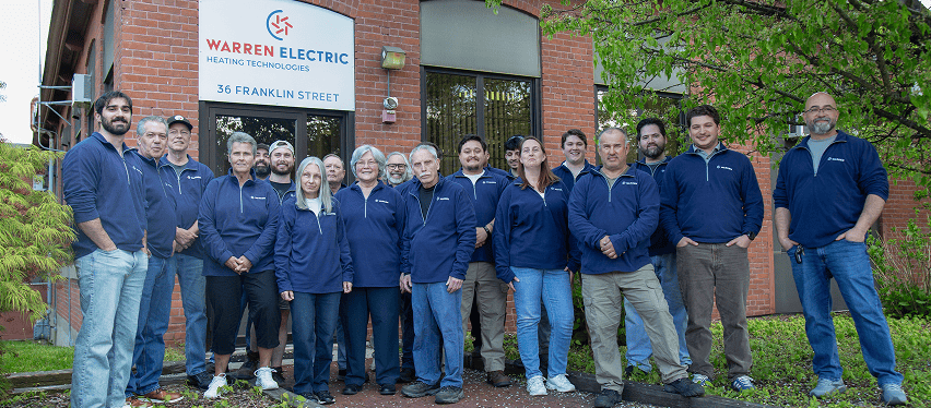 The team in front of the Warren Electric office